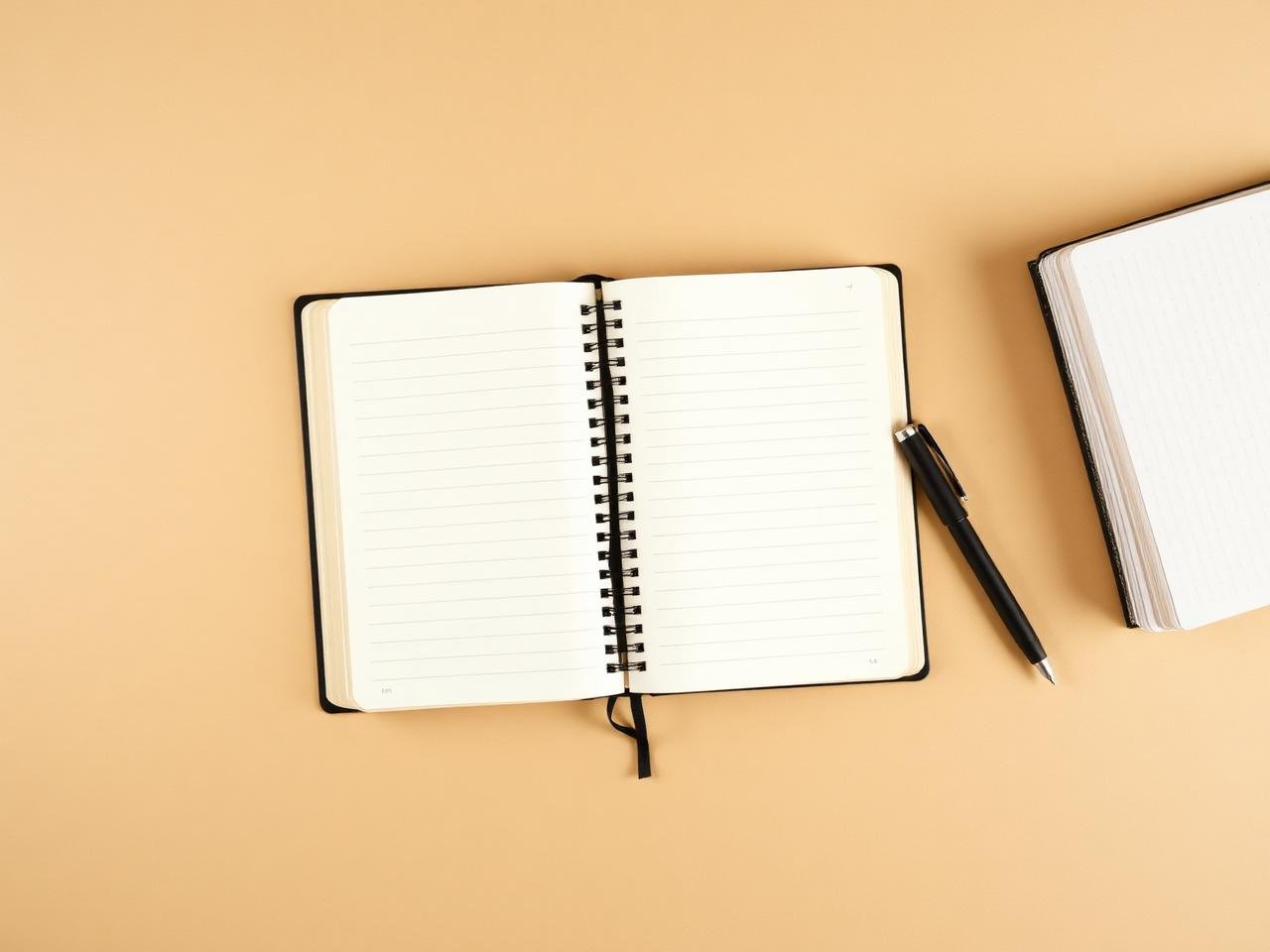 Open notebook with pen